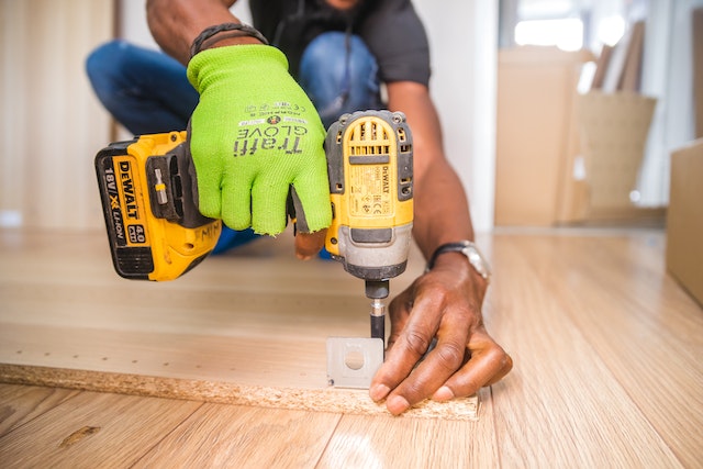 person using drill to perform renovation