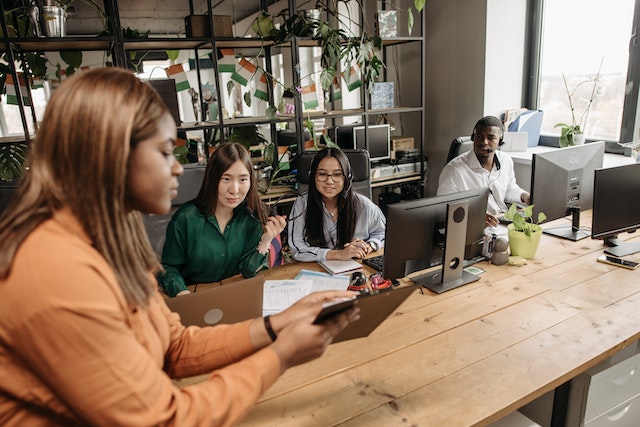 employees collaborating in office