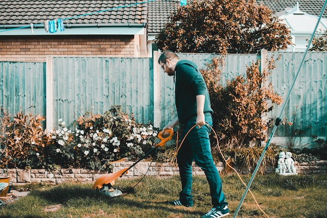 man cutting grass