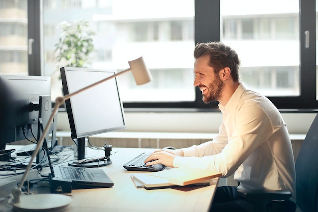 person using computer for marketing