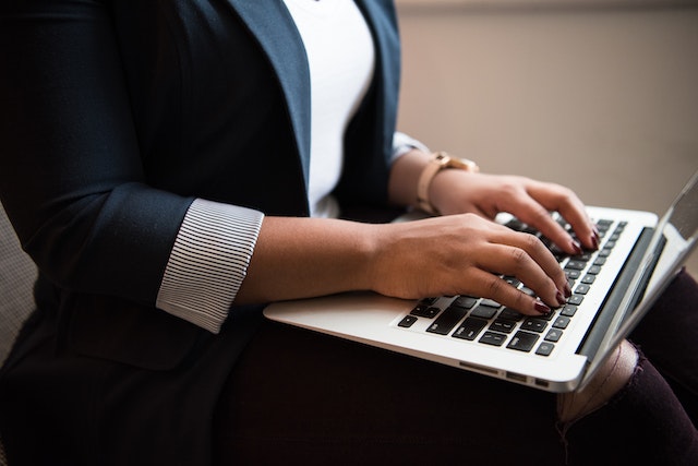 a person typing on a computer